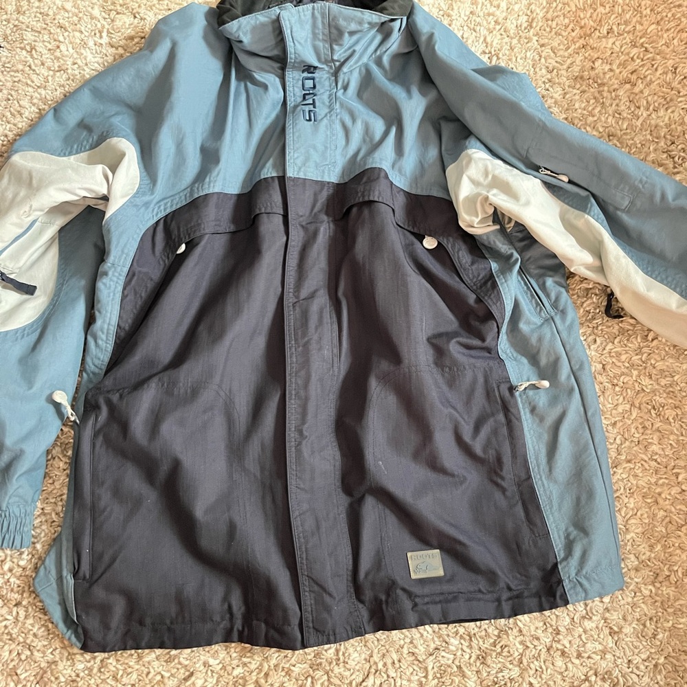 Roots Athletics, Quality and Integrity blue ski jacket.